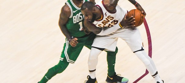 James protects the ball from Kyrie Irving in October 2017. The two were teammates in Cleveland for three seasons.